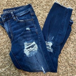 Super distressed mid rise jeggings